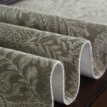 coffee floral table runner folded flat, showing double-layered fabric and botanical pattern