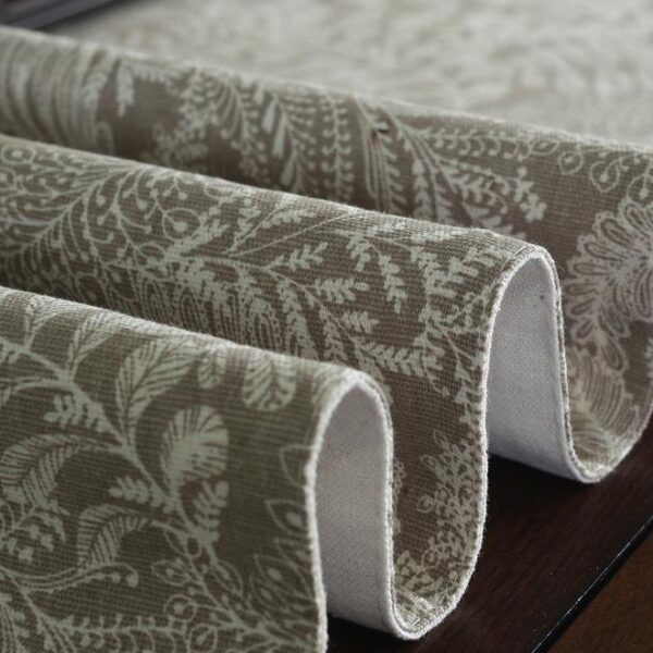 coffee floral table runner folded flat, showing double-layered fabric and botanical pattern