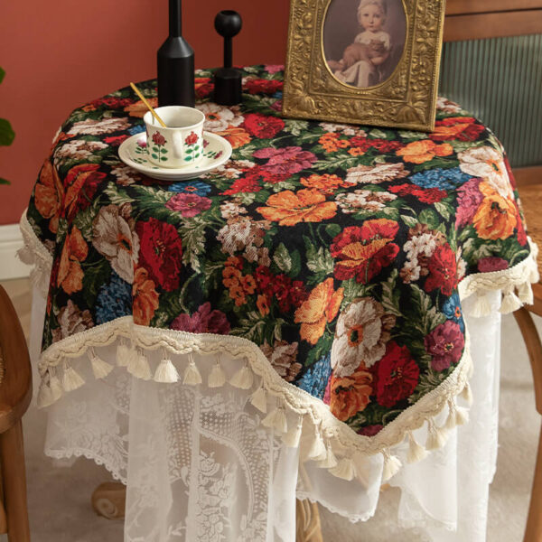 Vintage floral tablecloth decor with tassels, black tone on round table
