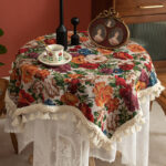 Vintage floral tablecloth decor with tassels, white tone on round table