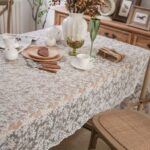 white lace embroidered tablecloth with dot leaf pattern styled on dining table