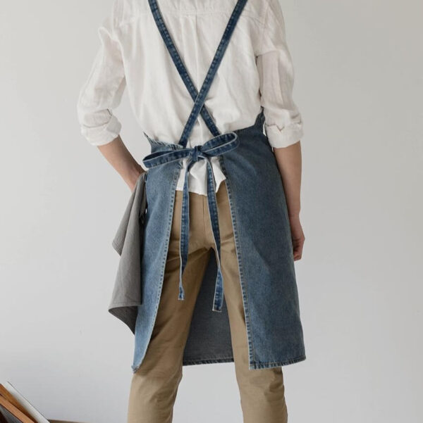 Vintage denim barista apron back view with cross-tied waist