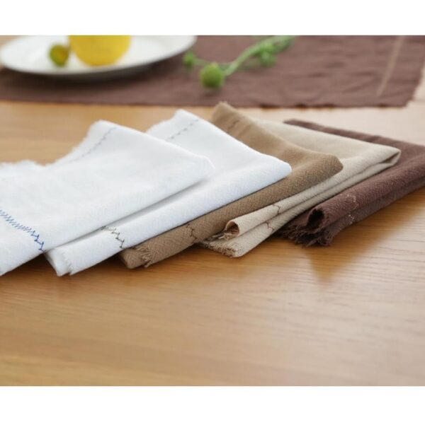 Stack of five cotton linen blend placemats showing all color variations