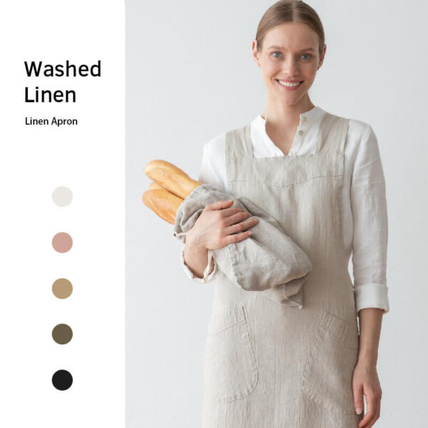 Cotton linen gardening apron in use, model holding bread