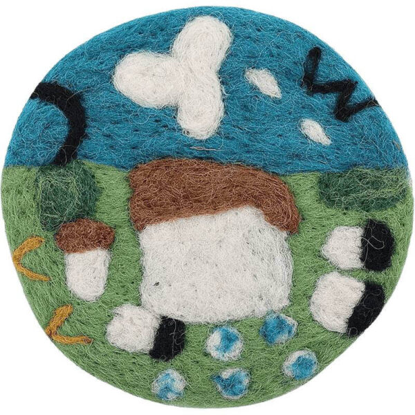 close-up of handmade wool felt coaster spring prairie design with sheep and flowers