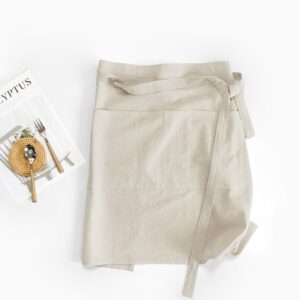 Half Linen Style Simple Apron light beige lifestyle flat lay, 100% washed cotton faux linen half waist apron for home baking and coffee shop