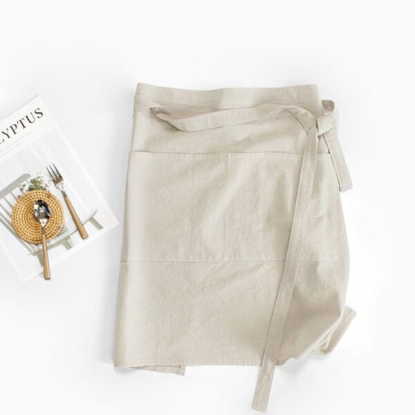 Half Linen Style Simple Apron light beige lifestyle flat lay, 100% washed cotton faux linen half waist apron for home baking and coffee shop
