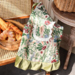 Peony Garden floral apron with lace ruffle pocket, vintage polyester kitchen apron in bakery setting
