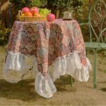 american floral table runner with blue ginkgo pattern and lace trim