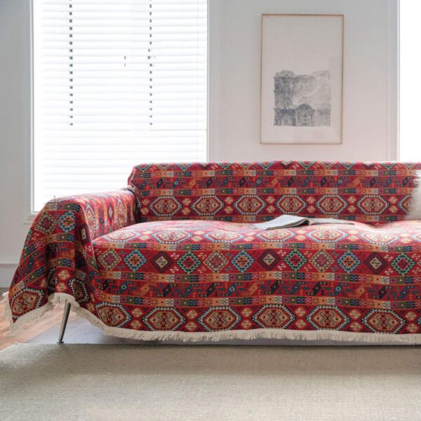 red badge jacquard couch throw with ethnic woven pattern and soft fringe