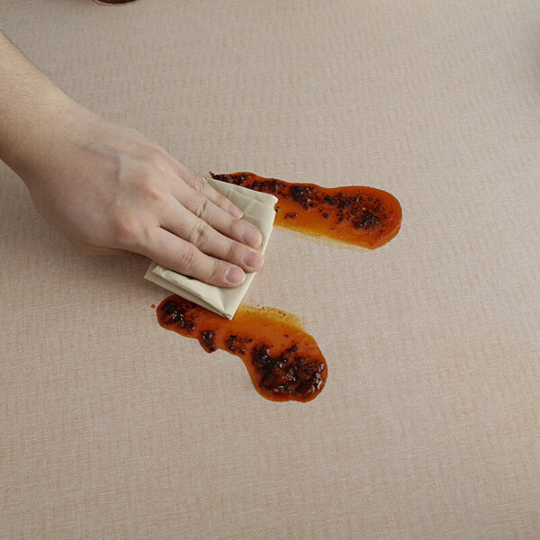 stain resistant tablecloths Waterproof, demonstration of wiping food spills off stain-proof TPU coated cotton linen tablecloth