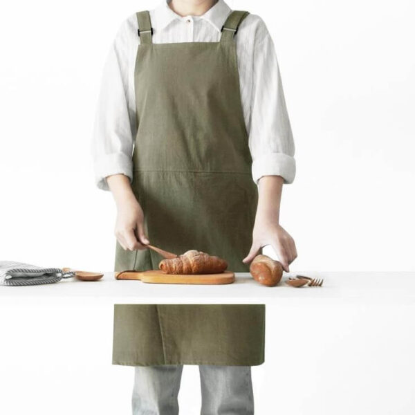 Adjustable Strap Shoulder Apron moss green cotton linen split front apron model cooking croissant in kitchen