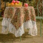 american floral table runner with green ginkgo pattern and lace trim