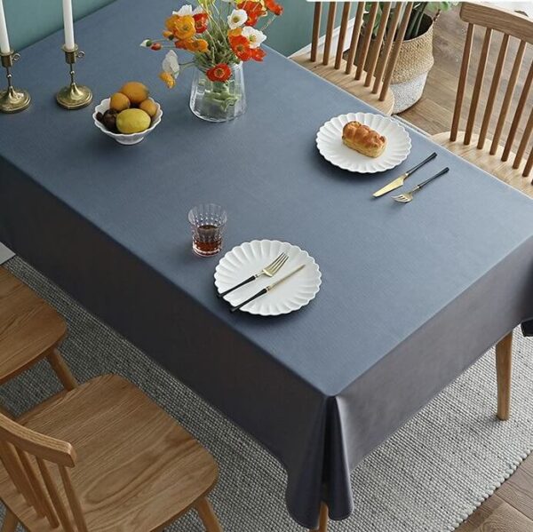 stain resistant tablecloths Waterproof, deep gray cotton linen waterproof tablecloth, minimalist farmhouse dining table setting with tableware and flowers