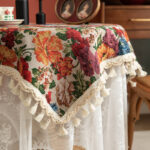 Vintage floral tablecloth decor with tassels, white tone side view showing fringe