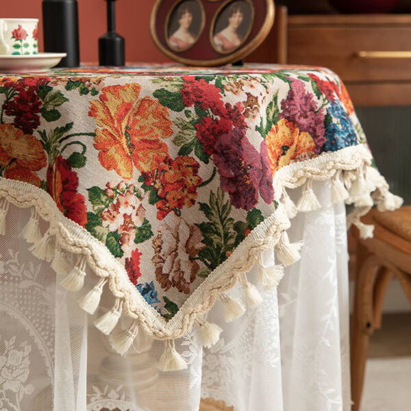Vintage floral tablecloth decor with tassels, white tone side view showing fringe