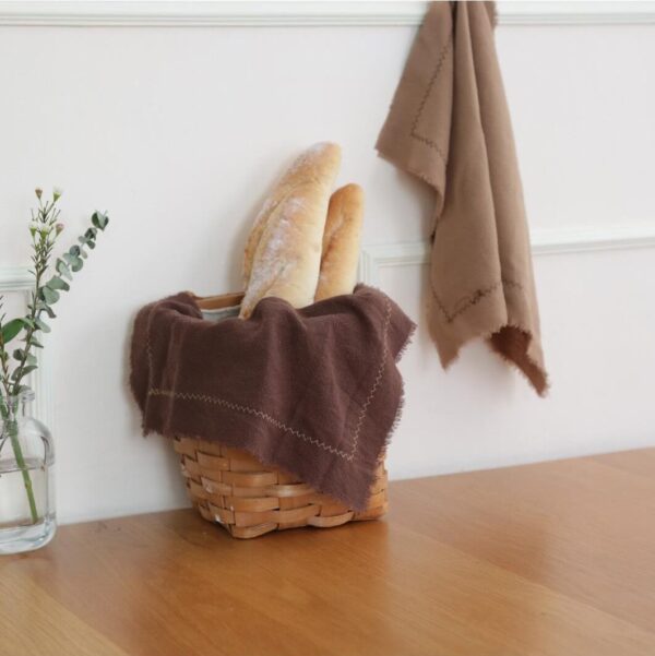Cotton linen blend placemats styled with bread and greenery for food photography