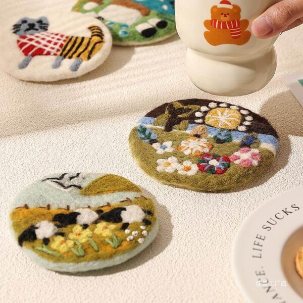 handmade wool felt coasters paired with a mug on a cozy table setting