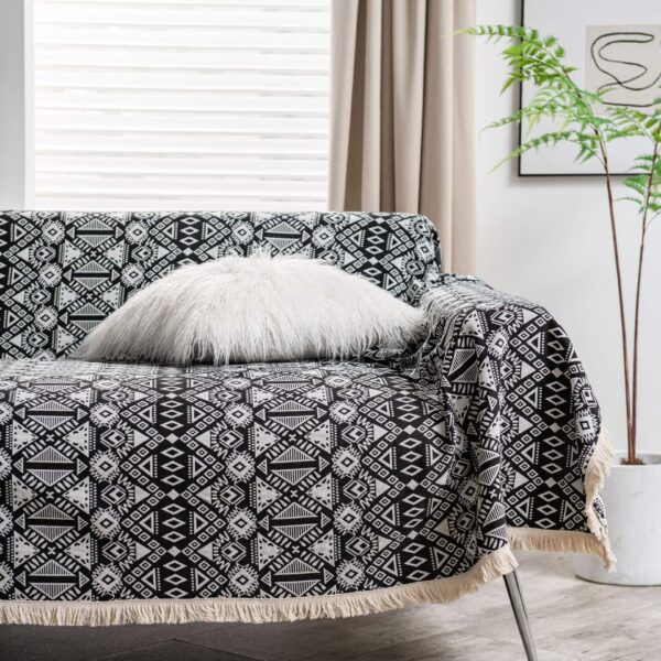 Cat proof bohemian sofa cover black and white badge print, styled living room view