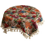 Vintage floral tablecloth decor with tassels, white tone flat lay view
