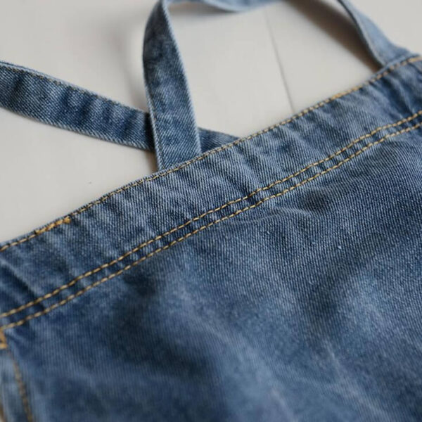 Vintage denim barista apron shoulder strap and fabric detail