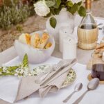 natural linen cocktail napkins set on outdoor dining table