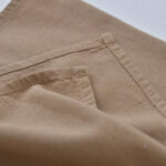 Close-up of cotton linen gardening apron pocket stitching