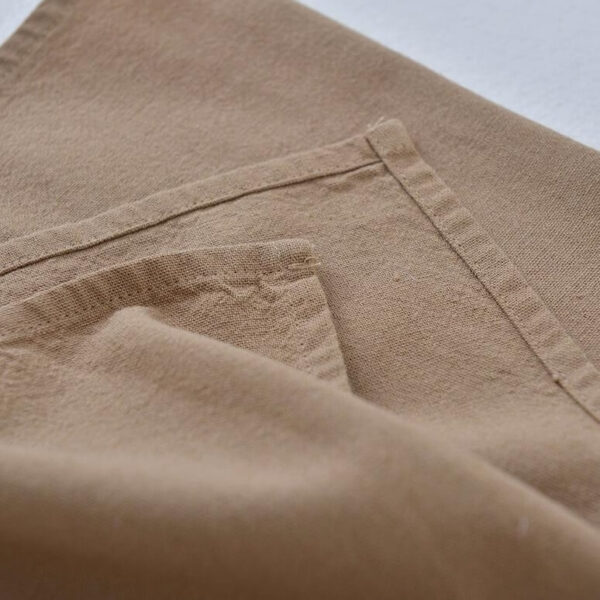 Close-up of cotton linen gardening apron pocket stitching