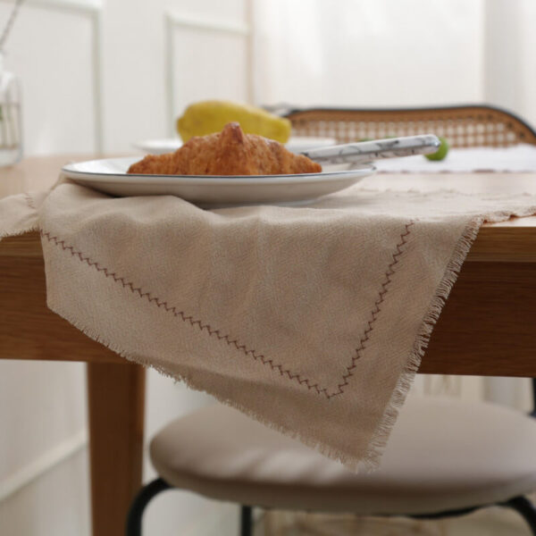 Milk tea herringbone cotton linen placemat styled with tableware for everyday use