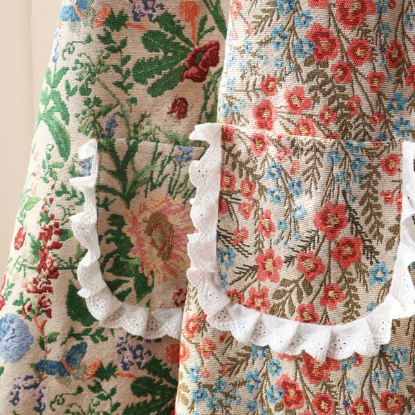 Close-up of Mia Floral and Peony Garden aprons, lace ruffle trim and floral print details on polyester fabric