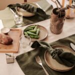 dark green natural linen cocktail napkins styled with tableware