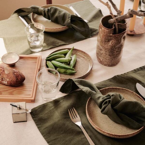 dark green natural linen cocktail napkins styled with tableware