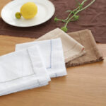 Five-color set of cotton linen blend placemats with herringbone pattern and fringed edges