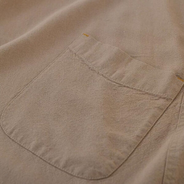 Close-up of washed cotton linen fabric texture for gardening apron