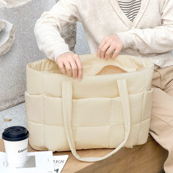 Soft Beige Quilted Nylon Tote Bag Open Top Handheld Lifestyle Shot