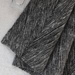 Italian Black Window Curtain fabric flat close-up, herringbone jacquard chenille texture detail, full blackout dark window curtain material