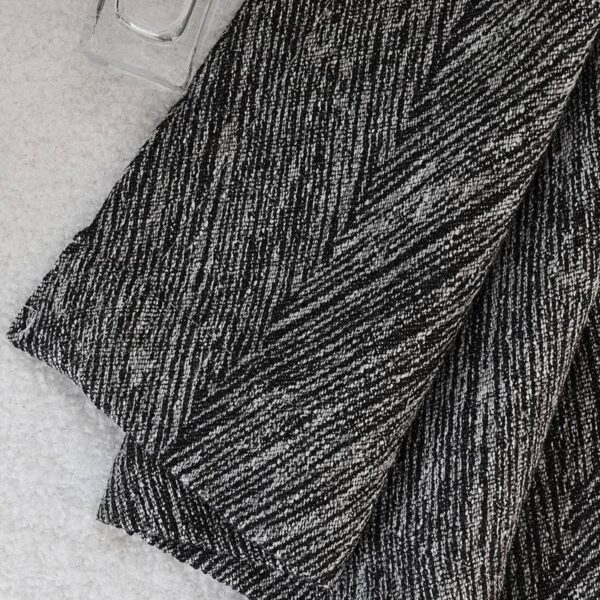 Italian Black Window Curtain fabric flat close-up, herringbone jacquard chenille texture detail, full blackout dark window curtain material