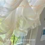 Jelly Sheer Roman Curtain fabric close-up, translucent beige sheer texture and ruffled hem detail