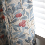 cottage blackout curtain panel, white base curtain printed with blue leaves and red berries, cotton blend botanical window drape