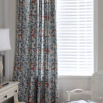 cottage blackout curtain panel hanging beside window, blue leaf red berry botanical print room darkening single curtain panel