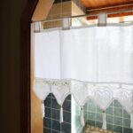 white cotton linen‑look tie‑top valance with heart lace tassels above kitchen sink window