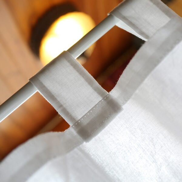 close‑up view of fabric tie‑top header on white cotton linen‑look window valance