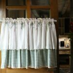 Bow‑decorated short cafe curtain fitted on home kitchen window