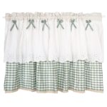 White lace‑ruffled short kitchen window tier curtain with green plaid hem and bow decor