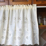 White floral short curtain ruffled rod‑pocket tier curtain hung on kitchen window
