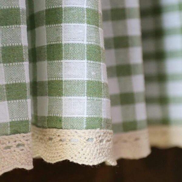 Close‑up of green and white gingham plaid fabric for short window curtain