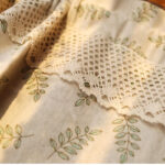 close‑up of crochet lace trim on 100% cotton leaf print short window curtains