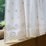white cottagecore cherry tier curtain showing hollow‑out embroidered hem cotton fabric
