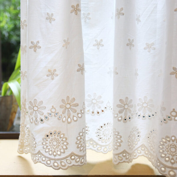 cottagecore cherry tier curtain close‑up of white cotton hollow‑out embroidery fabric