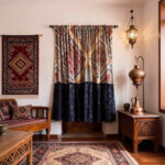 Colorful bohemian patterned curtain hanging on window, boho farmhouse home decoration